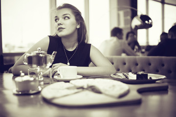 young adult girl in cafe