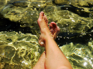 legs in the clear water of sea