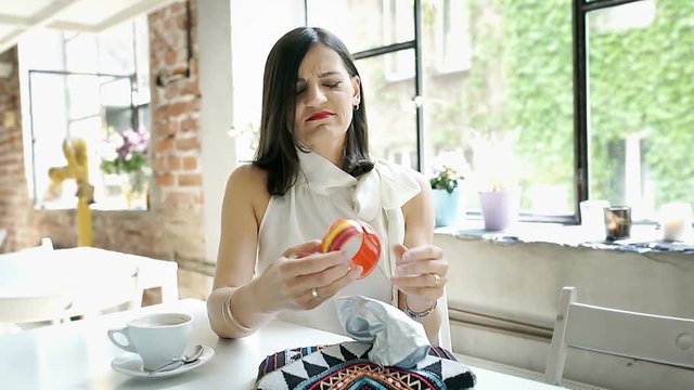 Elegant woman looks unhappy while checking bracelet, steadycam shot
