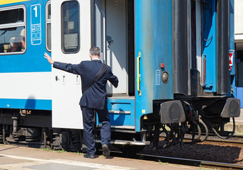 Fototapeta premium Train conductor at the station