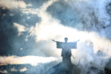 Obraz premium Silhouette monk on the mountain prayer moses faith god