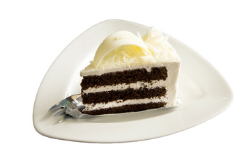 chocolate cream cake on white plate