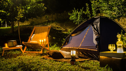 Romantic evening with a tent at night in the yard.