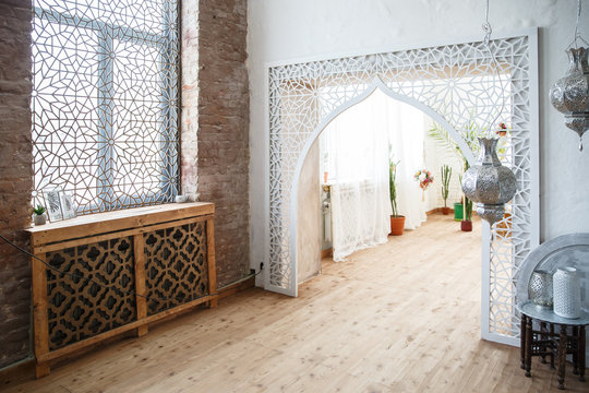 Eastern traditional interior. Arabic style room. Arch and window with beautiful carving