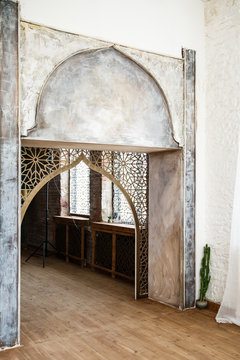 Eastern traditional interior. Arabic style room. Arch and window with beautiful carving