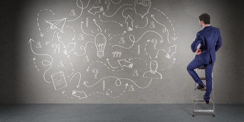 Obraz premium Businessman watching a project sketch on a wall 3D rendering