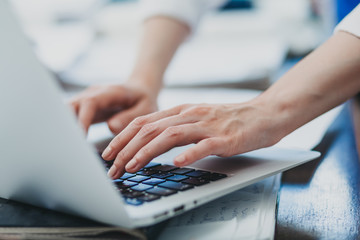 Woman typing on laptop