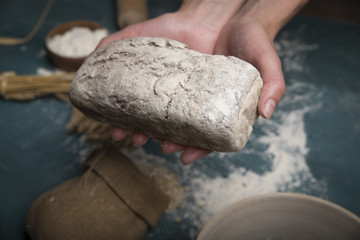 Bread border on wood with copy space background. Brown and white whole grain loaves still life composition with wheat ears scattered around. Bakery and grocery food store concept.