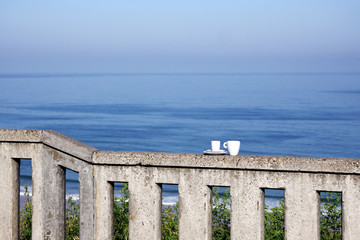 two cups and the ocean