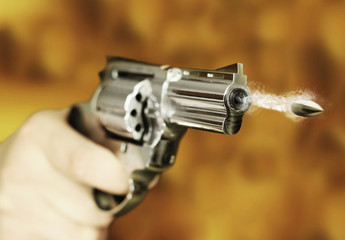 hand gun revolver with flying bullet fire