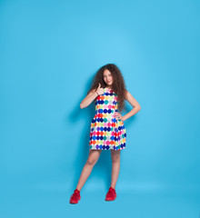 Curly girl gesturing thumb up