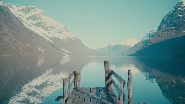 Old wooden pier at the lake in Norway