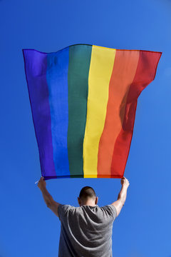 man with a rainbow flag