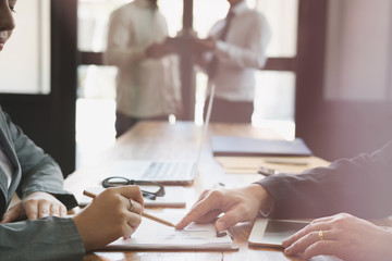 Businesswoman working with businessman. two business people discussing document and idea at meeting. Woman explaining her colleague in office.