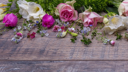 Festive flower composition on the old wooden background. Overhead view.