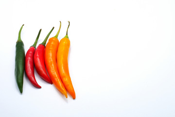 Red green yellow color chilli pepper isolated on white background with copy space