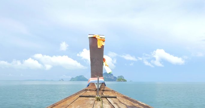 Boat ride through the warm and tropical waters near Railay Thailand