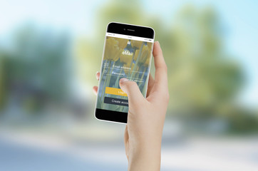 Hand holding smartphone with email app. User interface flat design. Blurred background