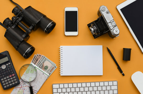 Flat Lay Of Accessories On Orange Desk Background