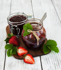 Strawberry jam and fresh strawberries