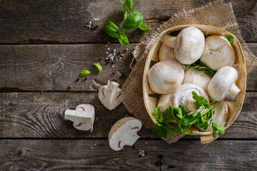Mushrooms on rustic wood background