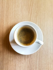 wonderful white cup of hot coffee on table