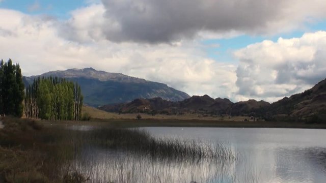Mountain lake in Patagonia Argentina. Unique landscape of wildlife. Beautiful nature background. Travel and tourism in picturesque world of stone rocks and hills.