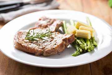 grilled pork chop with vegetable in plate