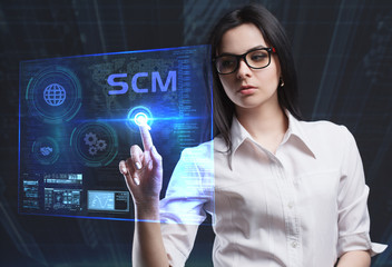 The concept of business, technology, the Internet and the network. A young entrepreneur working on a virtual screen of the future and sees the inscription: SCM