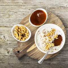Sweet milk porridge quinoa with honey and walnuts. Top view