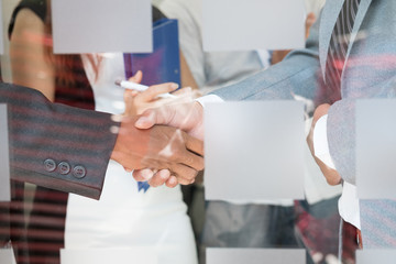 Business people shaking hands after finishing up a meeting. Businessman handshaking after conference. teamwork, partnership, collaboration, corporate concept.