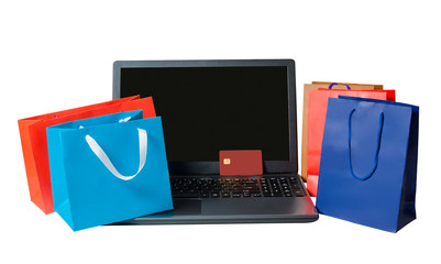 Shopping bags and open laptop isolated  on white background