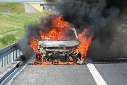 Car burning on a highway