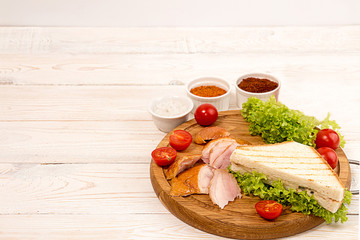 Sandwich with smoked grill chicken garnish with cherry tomato, lettuce