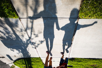 fun kids running on sidewalk