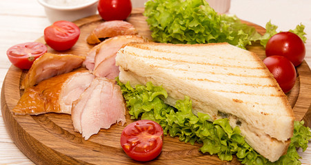 Sandwich with smoked grill chicken garnish with cherry tomato, lettuce