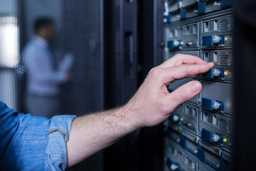 Close up of a male hand pressing the button