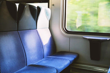 Three blue seats in modern European train