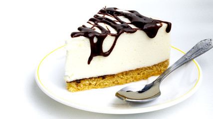 piece of cake bird's milk is on the plate on white background