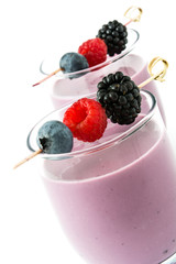 Healthy berry smoothie in glass isolated on white background

