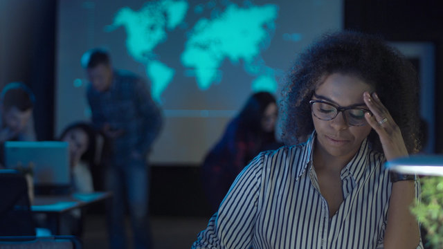 Tired Young African Woman Hardworker In Modern Late At Night Office Closing The Laptop And Taking Off Glasses And Close Her Eyes