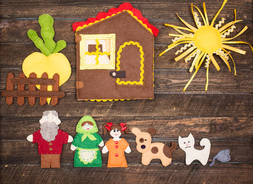 Handmade felt toys over wooden rustic background. Felt toys story fairy tale. Crafting concept.
