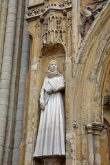 A sculpture of Mother Julian at the West entrance of Norwich Cathedral in Norwich, Norfolk, UK 