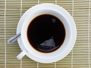 Obraz na płótnie Canvas Coffee time, white cup of black coffee on table