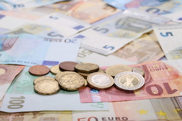 Euro bank notes with metal coins, bills background and texture