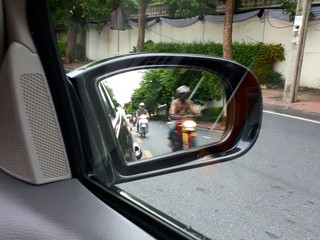 Side View Mirror with Motorcycle Approaching