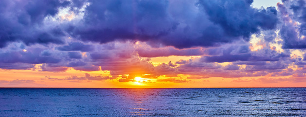 sunset over ocean. Sunset on the beach with beautiful sky. Dramatic sunset