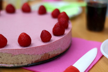 Vegan raw strawberry cake. Ingredients are: strawberries, coconut butter, coconut flour, cashew, dates, minced walnuts, stevia, vanilla and cocoa powder.  
