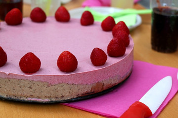 Vegan raw strawberry cake. Ingredients are: strawberries, coconut butter, coconut flour, cashew, dates, minced walnuts, stevia, vanilla and cocoa powder.  
