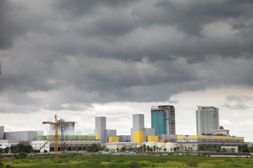 Power plant in the city and have The dark sky before rain will fall.